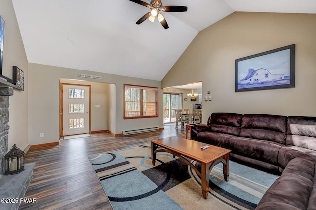 98 Roamingwood Rd, Lake Ariel, PA 18436 - living room with wood finished floors, a baseboard heating unit, baseboards, high vaulted ceiling, and ceiling fan with notable chandelier