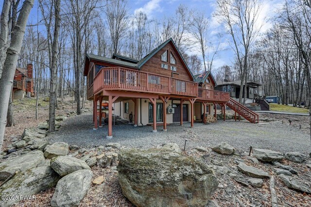 98 Roamingwood Rd, Lake Ariel, PA 18436 - back of house with stairway and a wooden deck