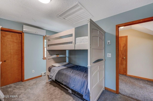 98 Roamingwood Rd, Lake Ariel, PA 18436 - bedroom with a wall mounted air conditioner, a baseboard radiator, a textured ceiling, carpet floors, and baseboards