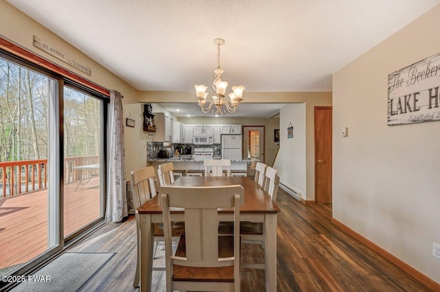 98 Roamingwood Rd, Lake Ariel, PA 18436 - dining area featuring a chandelier, a baseboard radiator, baseboards, and dark wood-style flooring
