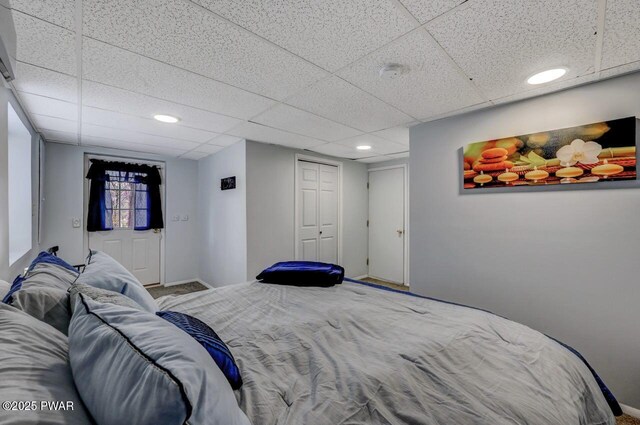 98 Roamingwood Rd, Lake Ariel, PA 18436 - bedroom featuring a paneled ceiling, a closet, baseboards, and carpet