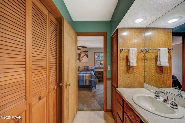 98 Roamingwood Rd, Lake Ariel, PA 18436 - ensuite bathroom featuring connected bathroom, vanity, tile patterned floors, and a closet