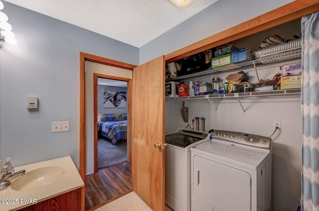 98 Roamingwood Rd, Lake Ariel, PA 18436 - laundry room with a textured ceiling, laundry area, a sink, and washer and clothes dryer