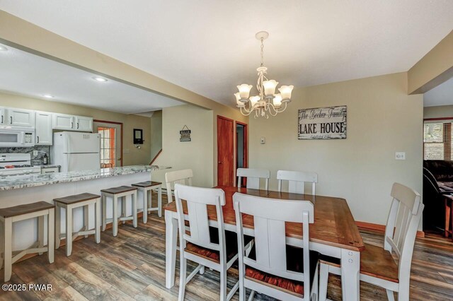98 Roamingwood Rd, Lake Ariel, PA 18436 - dining area featuring recessed lighting, wood finished floors, baseboards, and an inviting chandelier