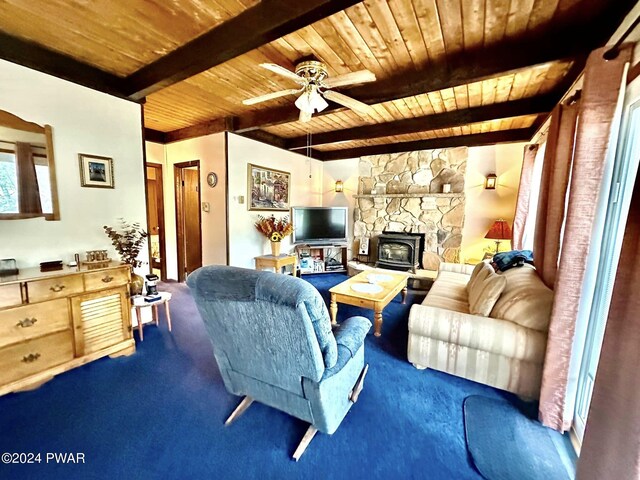 living room with a wood stove, ceiling fan, wooden ceiling, beamed ceiling, and carpet floors