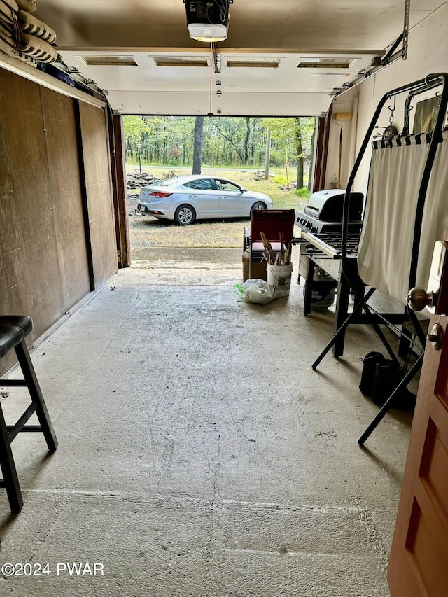 garage featuring a garage door opener