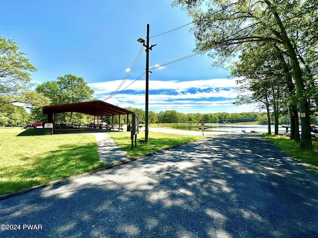 view of property's community with a lawn