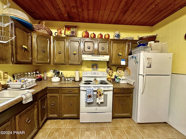 kitchen with dark brown cabinetry and white appliances