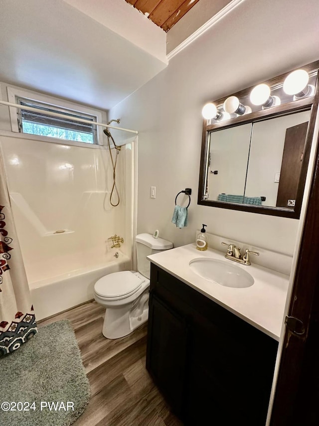 full bathroom featuring wood-type flooring, vanity, toilet, and shower / bath combo with shower curtain