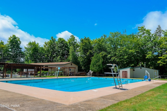 159 Windemere Ln, Lake Ariel, PA 18436 - community pool featuring an outbuilding, a pergola, view of scattered trees, and a patio area