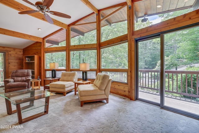 10 Cove Point Cir, Lakeville, PA 18438 - living room featuring beam ceiling, wooden walls, a ceiling fan, carpet, and high vaulted ceiling