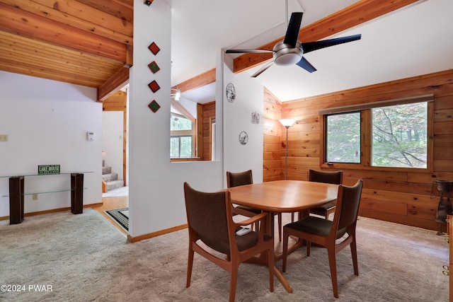 10 Cove Point Cir, Lakeville, PA 18438 - dining space with carpet flooring, wooden walls, stairway, and ceiling fan