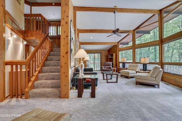 10 Cove Point Cir, Lakeville, PA 18438 - carpeted living room with beam ceiling, ceiling fan, stairway, and high vaulted ceiling