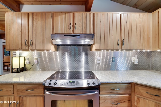 10 Cove Point Cir, Lakeville, PA 18438 - kitchen with stainless steel electric stove, under cabinet range hood, light brown cabinetry, backsplash, and lofted ceiling