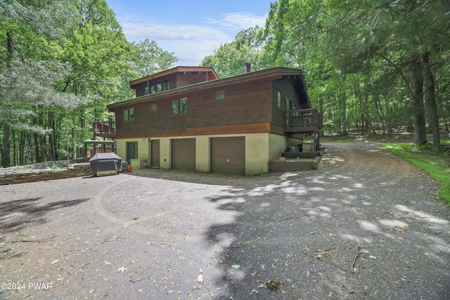 10 Cove Point Cir, Lakeville, PA 18438 - view of front of house with an attached garage and driveway