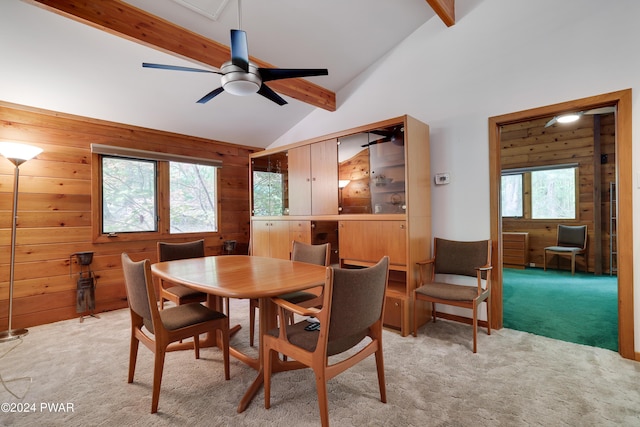 10 Cove Point Cir, Lakeville, PA 18438 - dining area featuring light carpet, wood walls, and ceiling fan