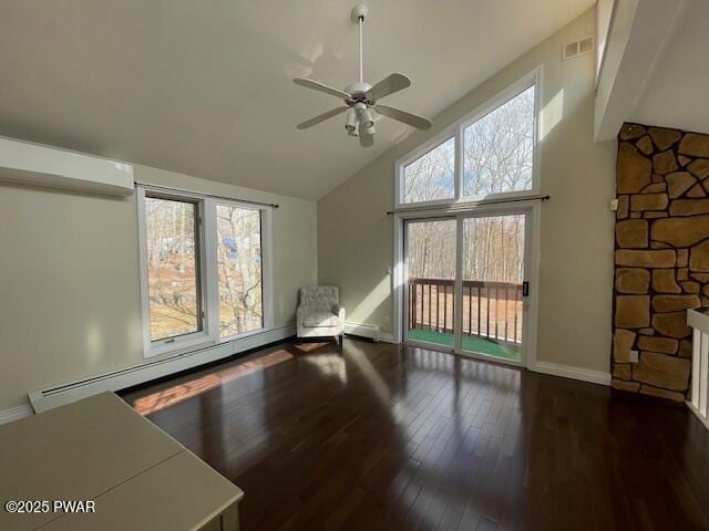 interior space featuring wood finished floors, visible vents, baseboards, high vaulted ceiling, and a baseboard heating unit