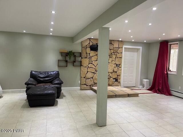 basement with light tile patterned flooring, recessed lighting, and baseboards