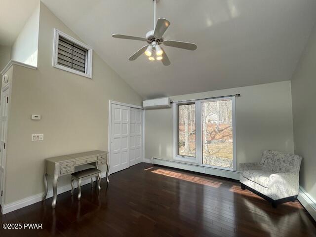 unfurnished room featuring a ceiling fan, wood finished floors, baseboards, a baseboard radiator, and an AC wall unit