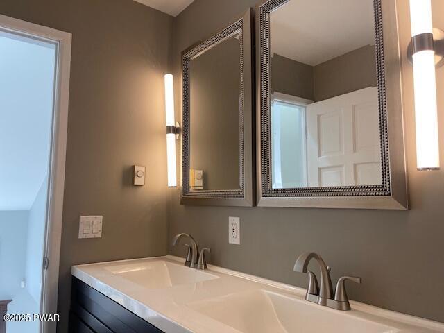 bathroom with double vanity and a sink