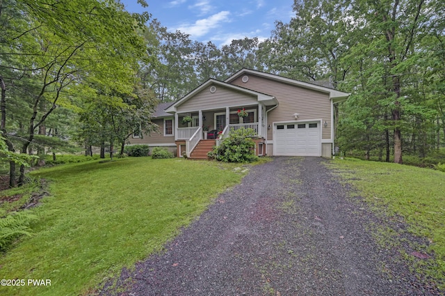 136 Weasel Rd, Dingmans Ferry, PA 18328 - view of front of home featuring covered porch, an attached garage, gravel driveway, and a front lawn