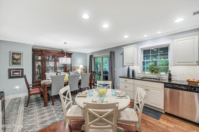 136 Weasel Rd, Dingmans Ferry, PA 18328 - dining space featuring crown molding, light wood-type flooring, and recessed lighting