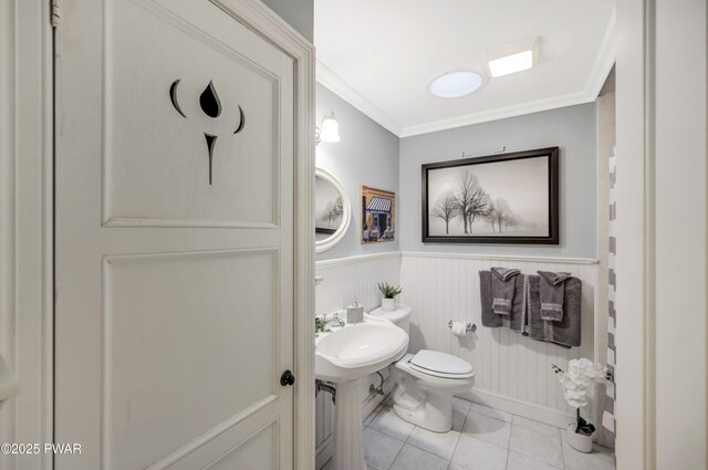 136 Weasel Rd, Dingmans Ferry, PA 18328 - bathroom featuring crown molding, tile patterned flooring, and wainscoting
