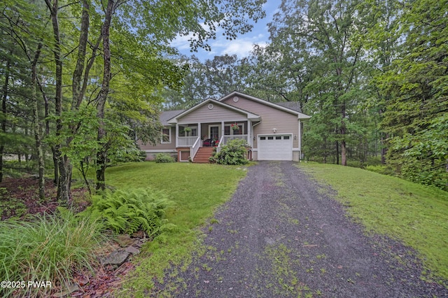 136 Weasel Rd, Dingmans Ferry, PA 18328 - ranch-style home with a garage, covered porch, driveway, and a front lawn