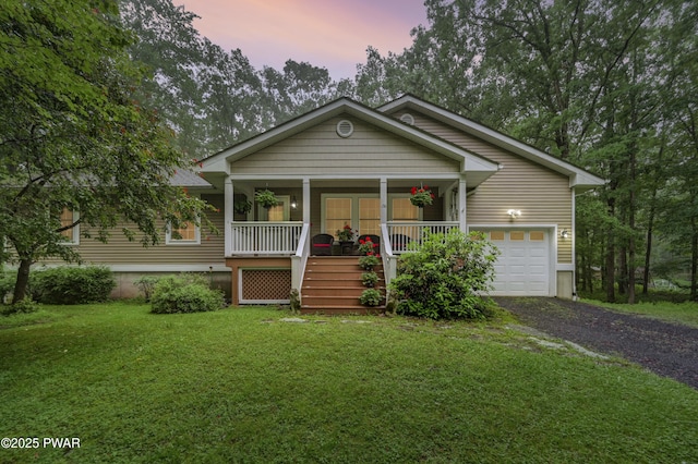 136 Weasel Rd, Dingmans Ferry, PA 18328 - view of front of house with covered porch, a yard, gravel driveway, and stairway