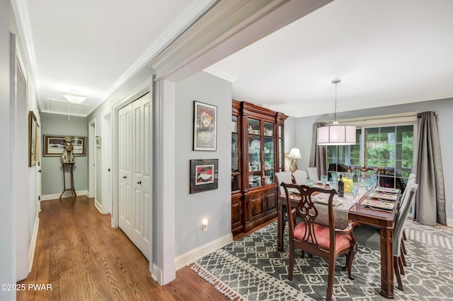 136 Weasel Rd, Dingmans Ferry, PA 18328 - dining space featuring attic access, crown molding, and wood finished floors