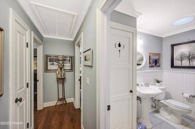 136 Weasel Rd, Dingmans Ferry, PA 18328 - bathroom with a wainscoted wall, ornamental molding, and wood finished floors