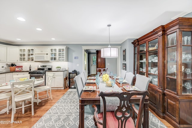 136 Weasel Rd, Dingmans Ferry, PA 18328 - dining area featuring crown molding, light wood-style flooring, and recessed lighting