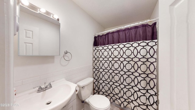 152 Fairview Dr, Dingmans Ferry, PA 18328 - bathroom featuring tile walls, toilet, vanity, a textured ceiling, and a shower with curtain
