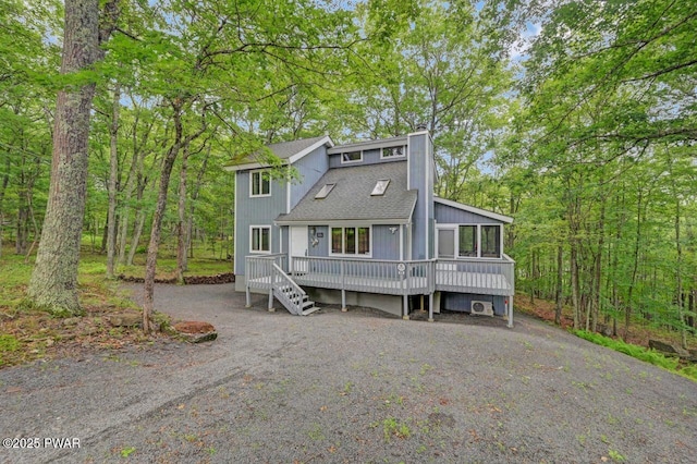 108 Minnow Ct, Lackawaxen, PA 18435 - view of front of house with a chimney, a wooden deck, and roof with shingles
