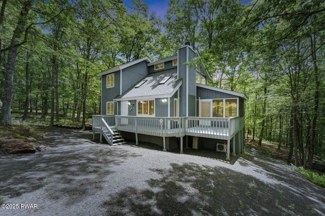 108 Minnow Ct, Lackawaxen, PA 18435 - view of front of property with a deck, a chimney, and a shingled roof