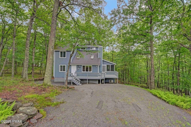 108 Minnow Ct, Lackawaxen, PA 18435 - view of front of house featuring asphalt driveway and a sunroom