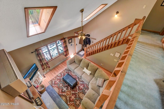 108 Minnow Ct, Lackawaxen, PA 18435 - living room featuring a towering ceiling, healthy amount of natural light, a skylight, and a ceiling fan