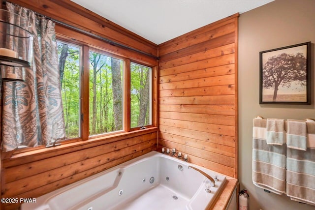 108 Minnow Ct, Lackawaxen, PA 18435 - bathroom featuring a jetted tub and wood walls