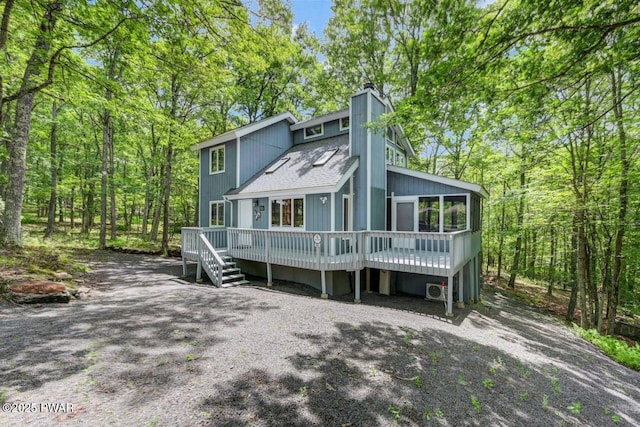 108 Minnow Ct, Lackawaxen, PA 18435 - view of front of home featuring a wooden deck, a chimney, and roof with shingles