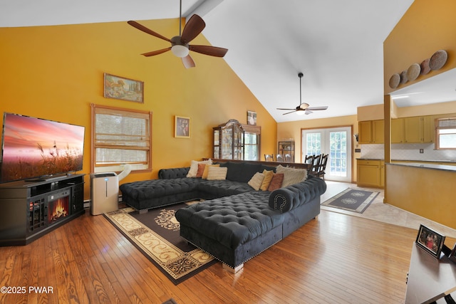 135 Kiel Rd, Milford, PA 18337 - living room with a ceiling fan, high vaulted ceiling, hardwood / wood-style flooring, and healthy amount of natural light