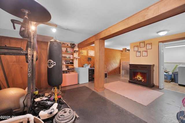 135 Kiel Rd, Milford, PA 18337 - exercise room featuring wood walls and a lit fireplace
