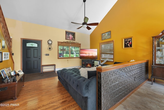 135 Kiel Rd, Milford, PA 18337 - living area featuring ceiling fan, high vaulted ceiling, wood finished floors, and a baseboard radiator