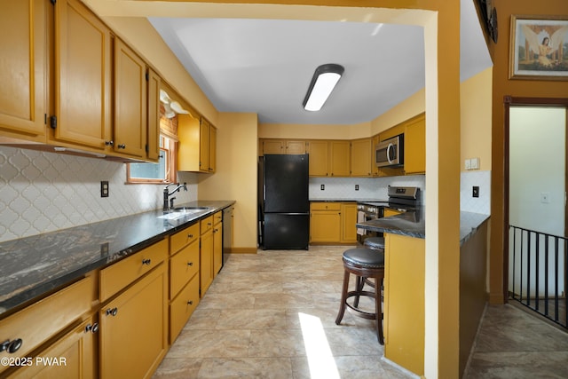 135 Kiel Rd, Milford, PA 18337 - kitchen with stainless steel appliances, decorative backsplash, stone finish flooring, and a breakfast bar area