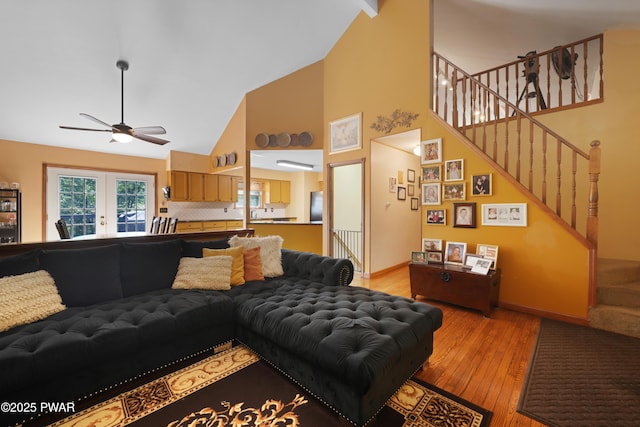 135 Kiel Rd, Milford, PA 18337 - living area with high vaulted ceiling, ceiling fan, light wood-type flooring, stairway, and french doors