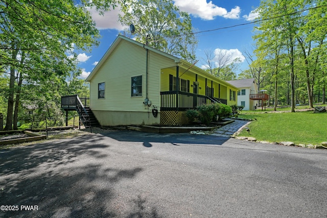135 Kiel Rd, Milford, PA 18337 - view of home's exterior with stairs, a yard, and a wooden deck