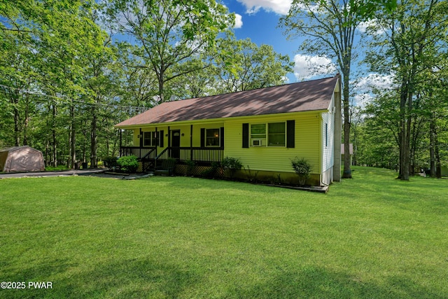 135 Kiel Rd, Milford, PA 18337 - view of front of house with a porch, a front lawn, and a shed