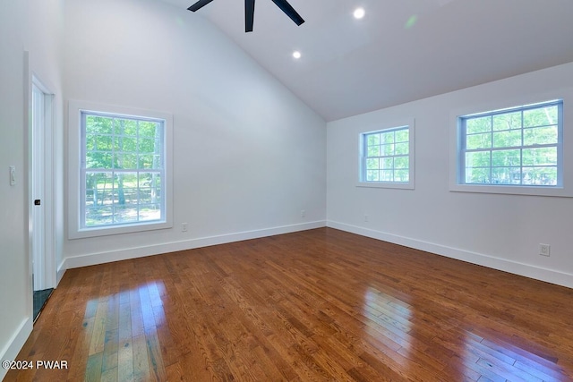 unfurnished room with ceiling fan, dark wood-type flooring, and high vaulted ceiling