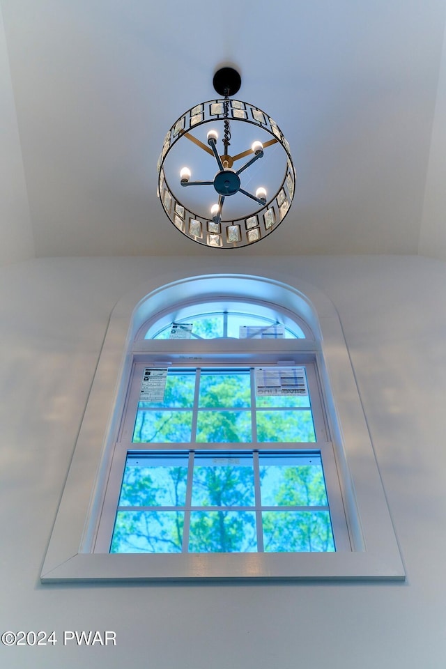 interior details featuring a notable chandelier