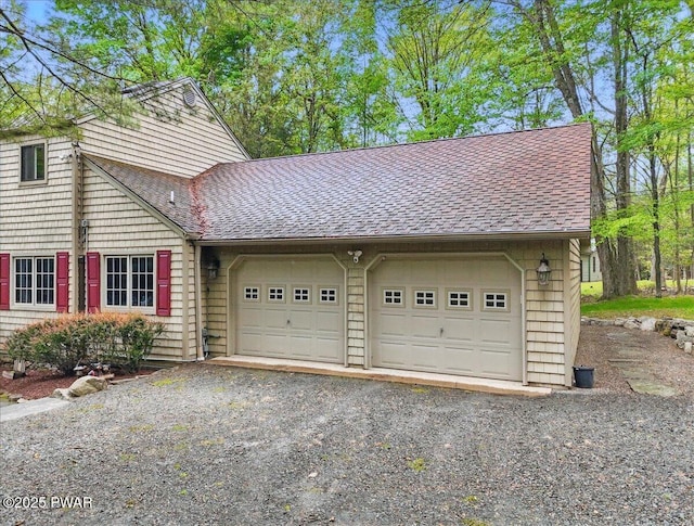 141 Arrowhead Cir, Newfoundland, PA 18445 - view of front of home featuring an attached garage, roof with shingles, and gravel driveway