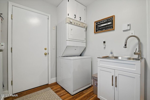 141 Arrowhead Cir, Newfoundland, PA 18445 - laundry area featuring stacked washer and clothes dryer, dark wood finished floors, and cabinet space